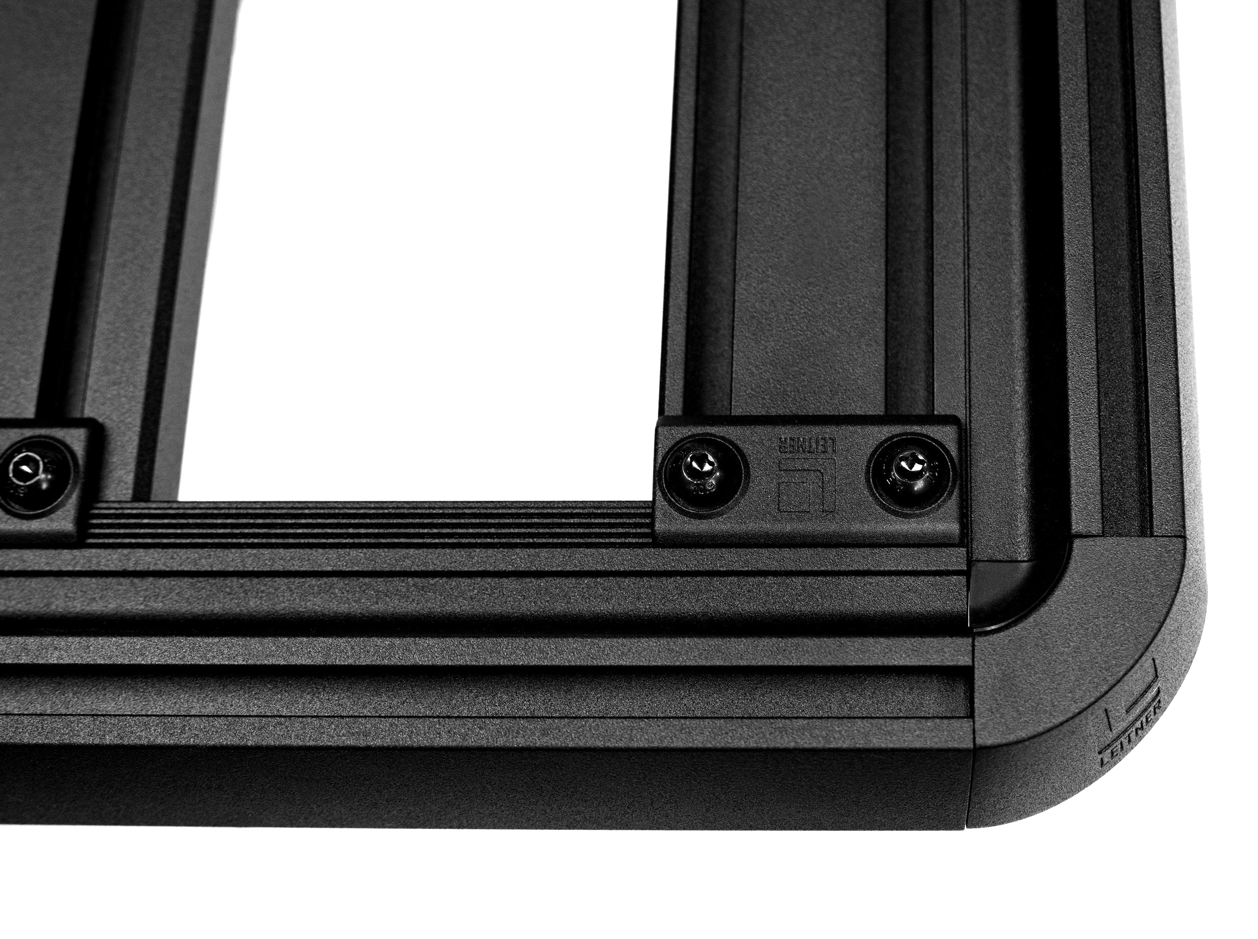 CLOSE UP VIEW OF ACS ROOF RACK CORNER CAP AND CROSS BAR