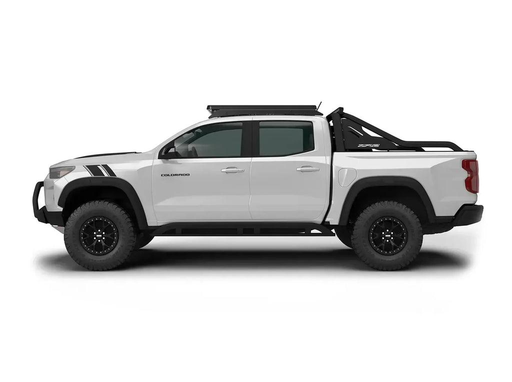 SIDE VIEW PROFILE OF WHITE CHEVY COLORADO WITH ACS ROOF RACK INSTALLED 