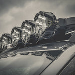 CLOSE UP VIEW OF LIGHTS ATTACHED TO ACS ROOF RACK SHOWING CORNER CAP WITH LEITNER LOGO 