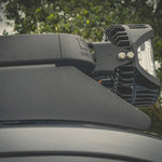 CLOSE UP SIDE VIEW OF LIGHTS ATTACHED TO ACS ROOF RACK SHOWING CORNER CAP WITH LEITNER LOGO