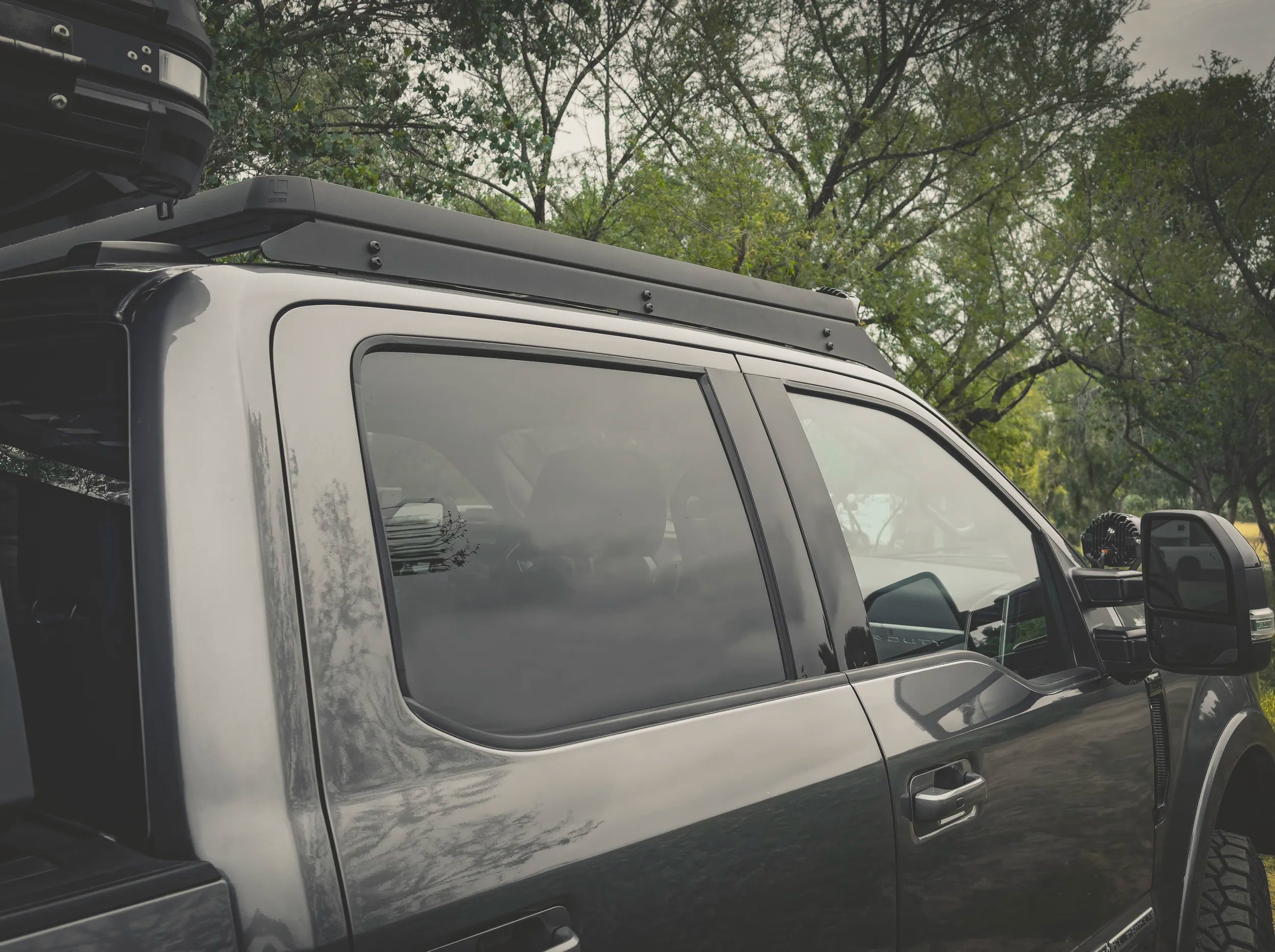 SIDE VIEW OF ACS ROOF RACK INSTALLED ON SUPERDUTY