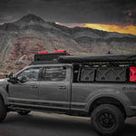 OUTSIDE SIDE VIEW OF FORD SUPERDUTY WITH OVER CAB ROOF RACK INSTALLED WITH ACCESSORIES 