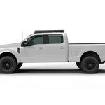 SIDE VIEW OF WHITE FORD SUPERDUTY TRUCK WITH ACS OVER CAB ROOF MOUNTED