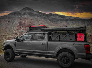 OUTSIDE SIDE VIEW OF FORD SUPERDUTY WITH OVER CAB ROOF RACK INSTALLED WITH ACCESSORIES 