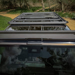 OVERHEAD VIEW OF 3/4 GRENADIER ROOF RACK AND FRONT LOAD BAR ON GRENADIER OUTSIDE
