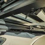 CLOSE UP VIEW OF UNDER NEATH THE ROOF TOP TENT WITH ROOF TOP TENT BRACKET 