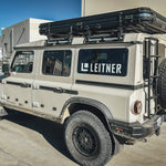 SIDE VIEW OF GRENADIER WITH ROOF TOP TENT MOUNTED 