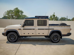 SIDE VIEW GRENADIER QUARTERMASTER TRUCK WITH HALF LENGTH ACS ROOF RACK MOUNTED