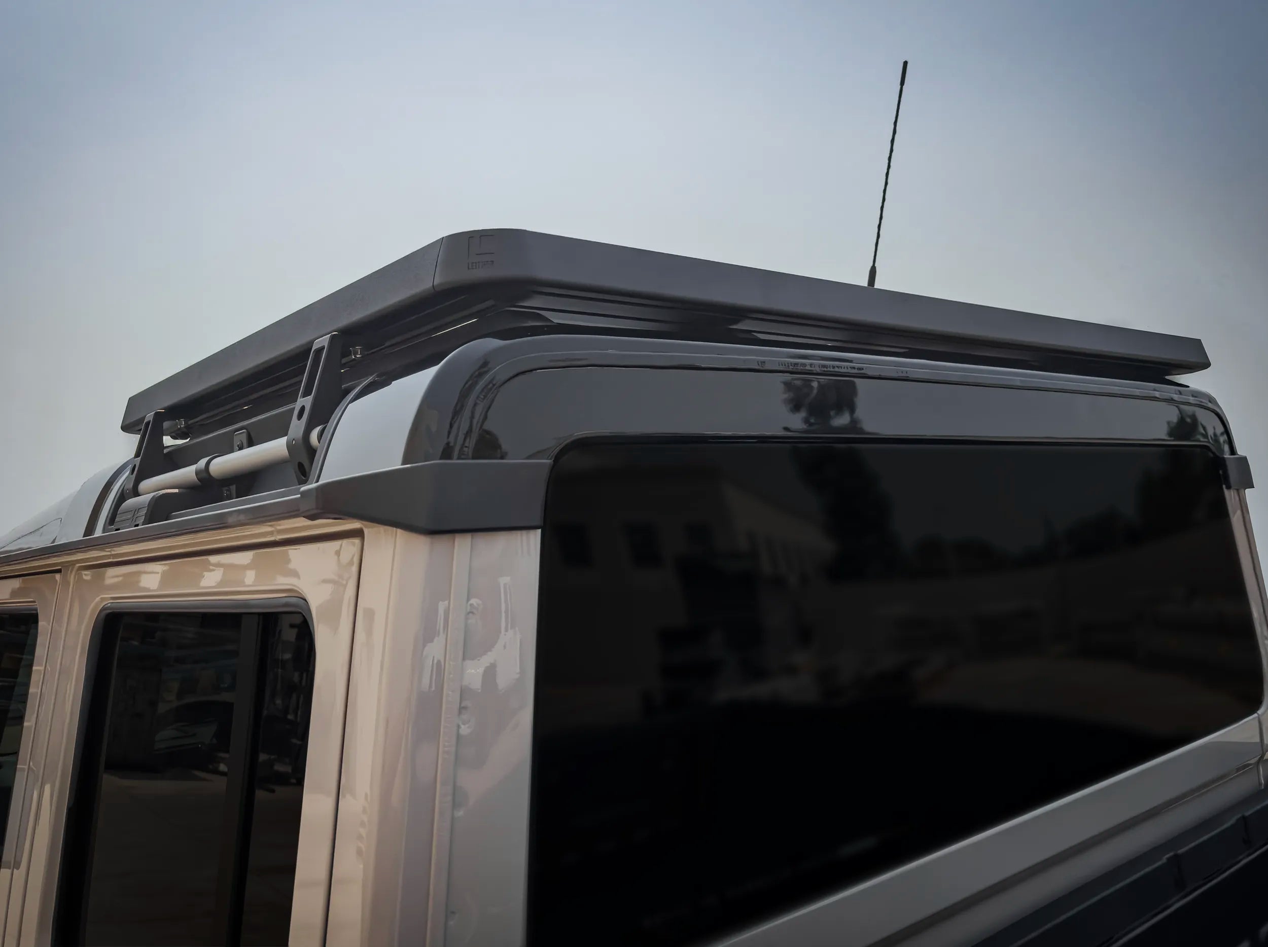 CLOSE UP REAR VIEW OF INEOS GRENADIER QUARTER MASTER HALF LENGTH PLATFORM ROOF RACK 