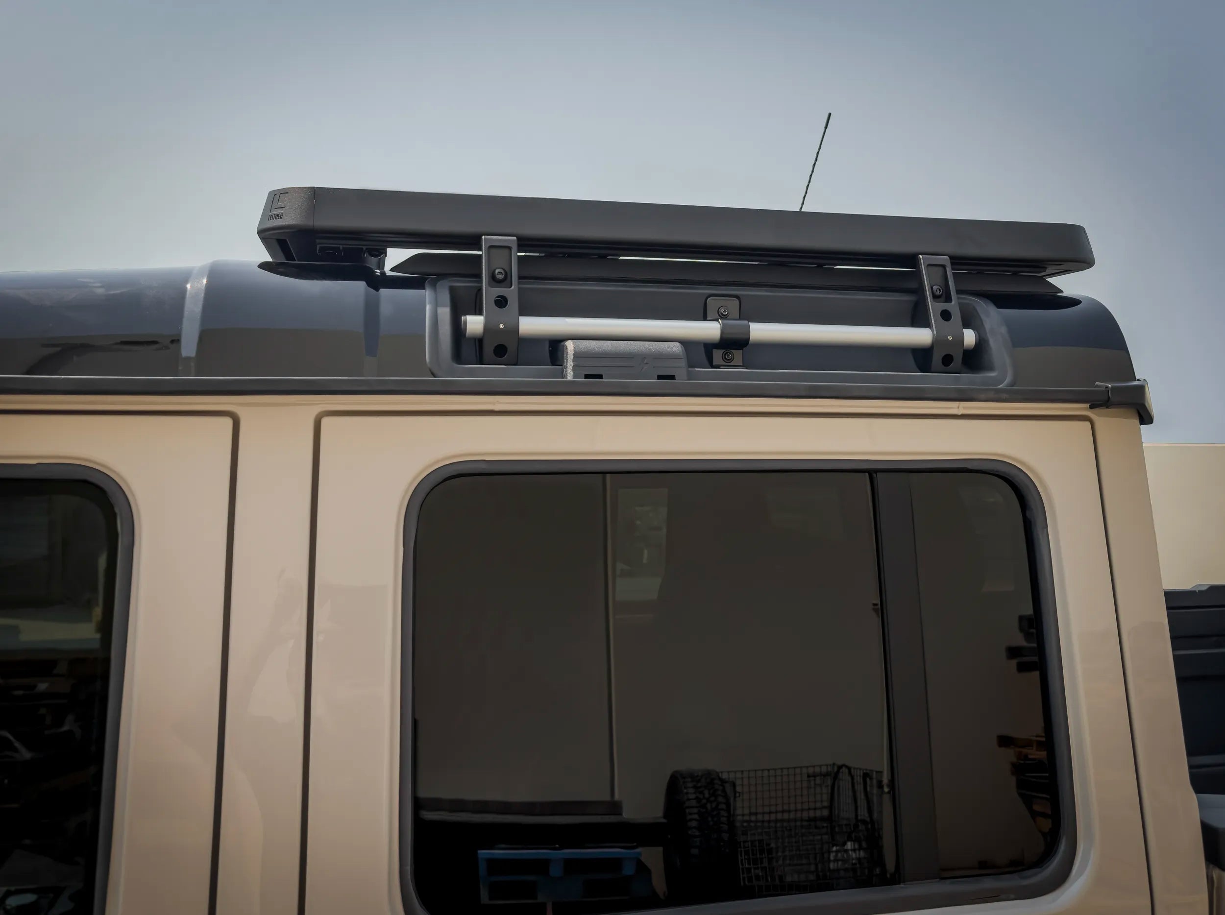 SIDE VIEW OF INEOS GRENADIER QUARTERMASTER HALF LENGTH PLATFORM RACK 