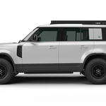 A white Land Rover Defender 110 with black wheels, black trim, and a roof rack, shown in a side profile view against a plain white background with a Leitner Designs ACS ROOF Platform Rack.