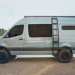 SIDE VIEW OF SPRINTER BUS WITH ROOF RACK MOUNTED 