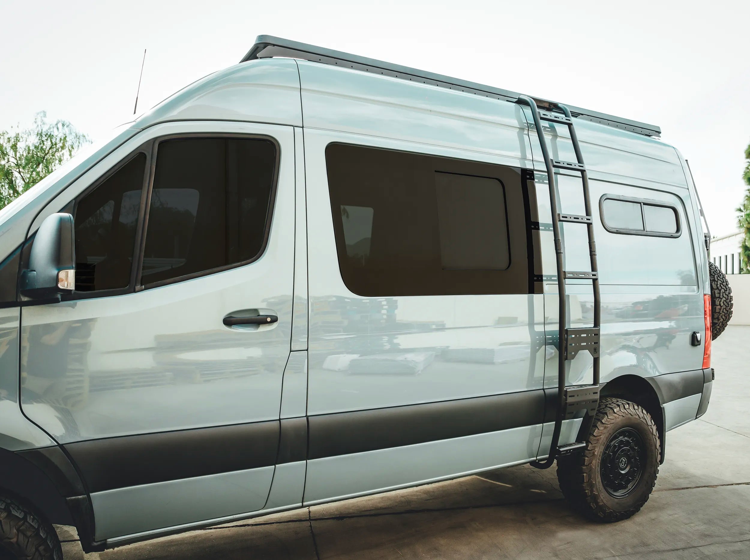 SIDE VIEW OF SPRINTER WITH ROOF RACK MOUNTED 