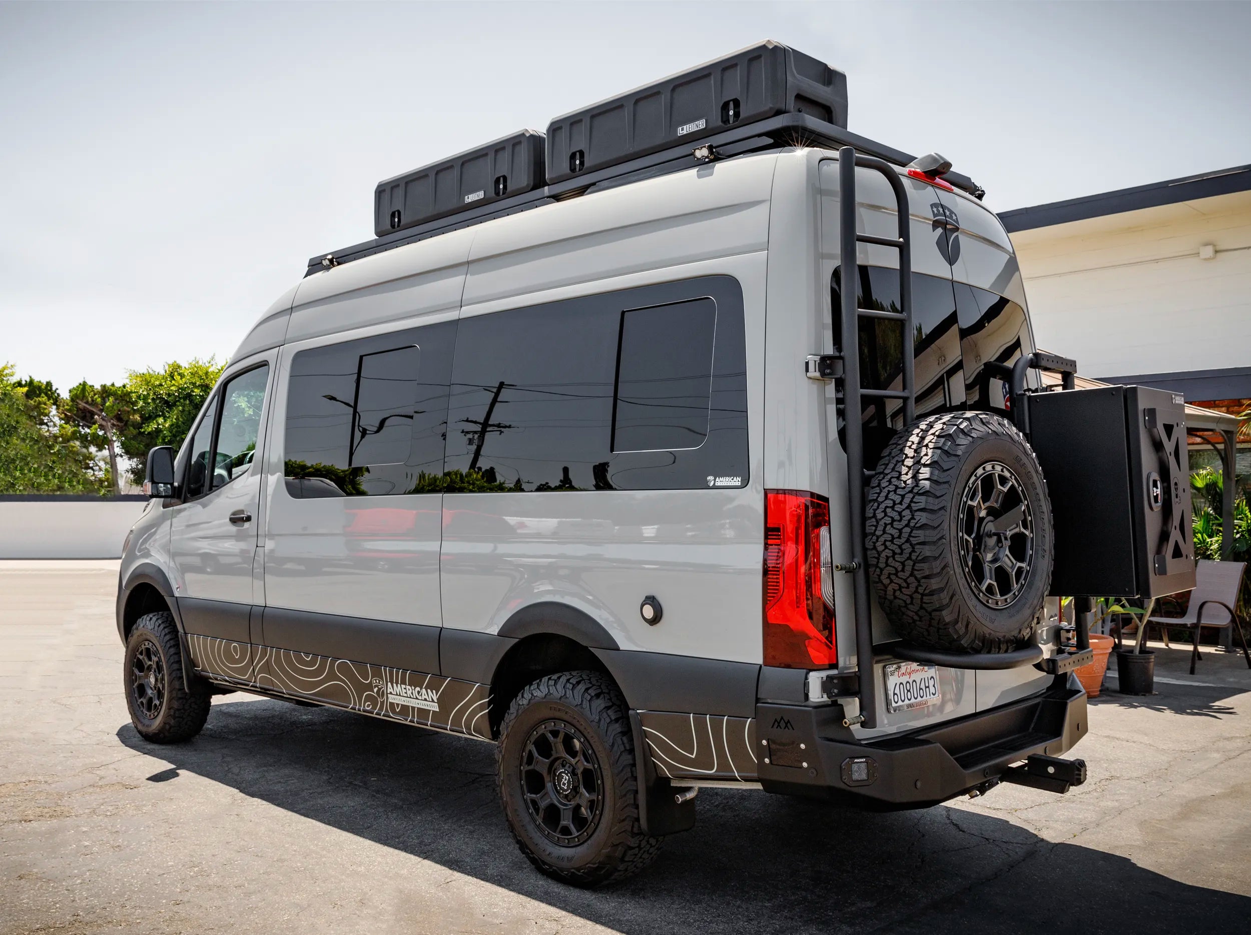 SIDE VIEW OF SPRITNTER BUS WITH GEARPOD ROOFS MOUNTED ON ROOF RACK