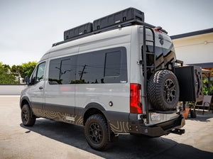 SIDE VIEW OF SPRITNTER BUS WITH GEARPOD ROOFS MOUNTED ON ROOF RACK
