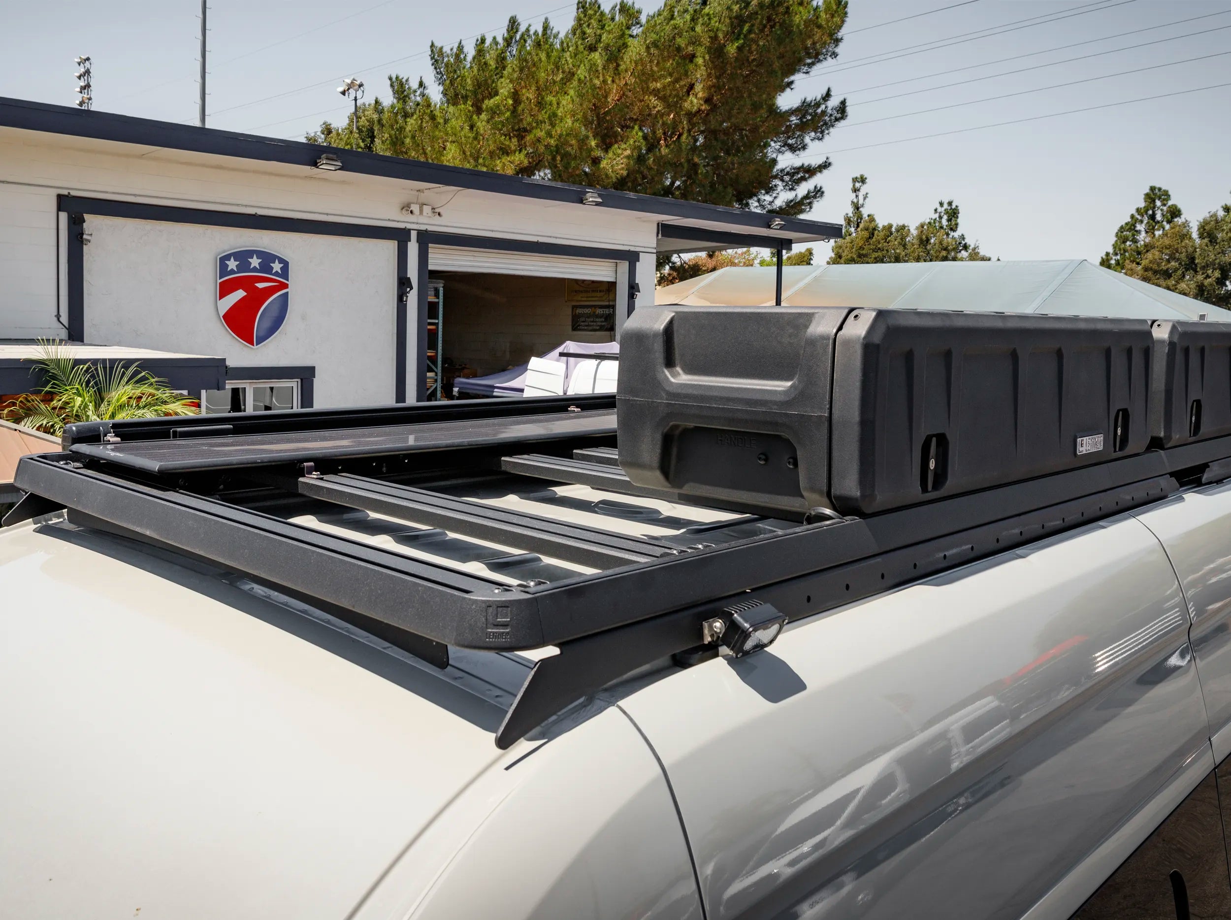 ABOVE CLOSE UP VIEW OF GEAR POD ROOFS MOUNTED ON ROOF RACK