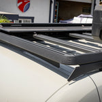 CLOSE UP OF BLACK ROOF RACK FOR SPRINTER BUS
