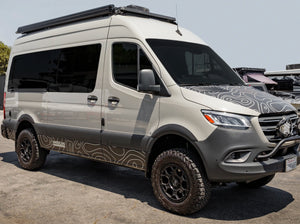 SIDE VIEW OF SPRINTER BUS WITH ROOF RACK 