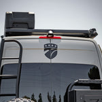 REAR VIEW OF SPRINTER BUS WITH ROOF RACK AND GEARPOD ROOFS MOUNTED