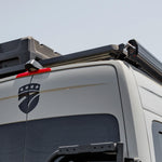 REAR VIEW OF SPRINTER BUS WITH ROOF RACK AND GEARPOD ROOF 