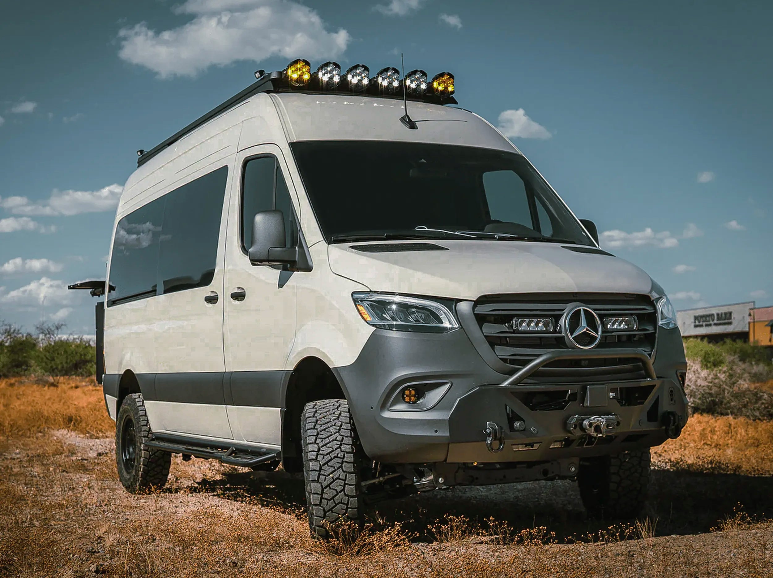 FRONT VIEW OF SPRINTER BUS WITH ROOF RACK