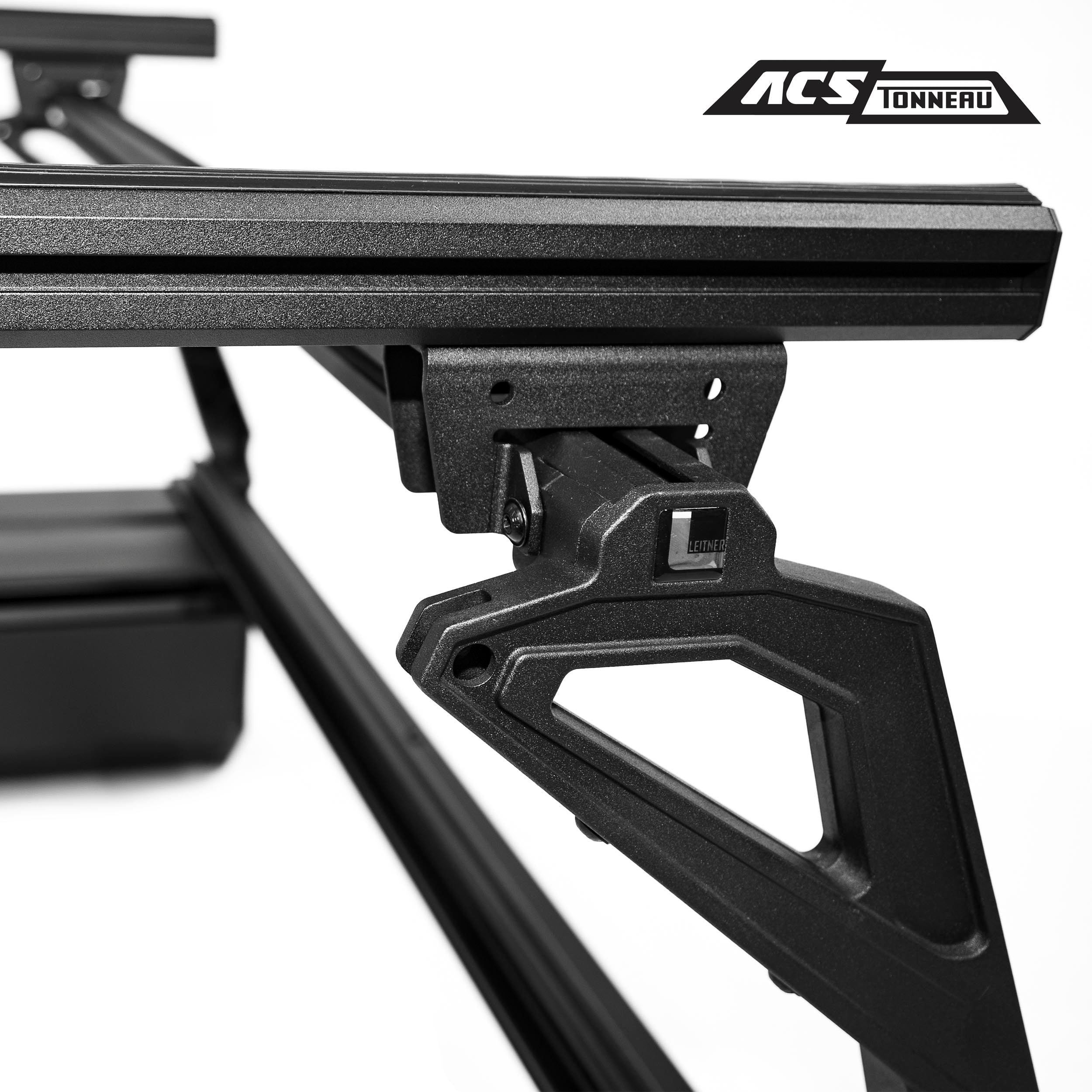 CLOSE UP VIEW OF STATIONARY LOAD BAR ON ACS TONNEAU RACK 